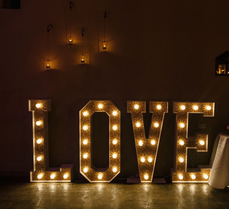 Wedding lighting ideas with letter lights spelling out 'LOVE' 