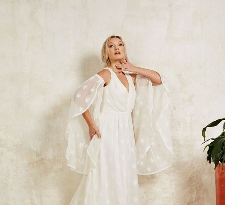 Sustainable wedding dress with dramatic detachable sleeves from Indiebride London in boho style