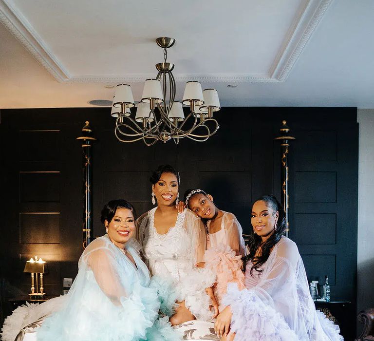 Bridal party and bride wearing pastel tulle mesh robes by Michael Maurer Photography