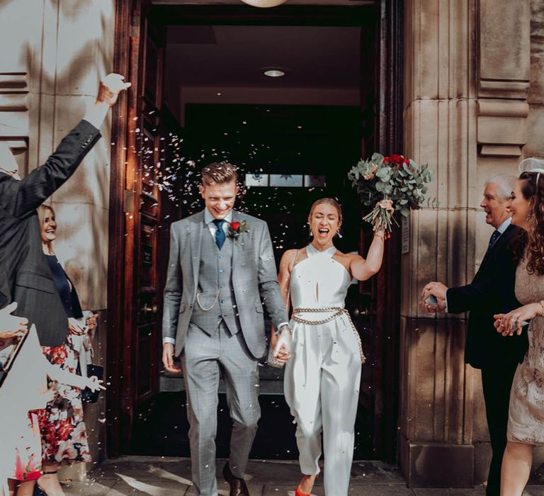 City Chambers Edinburgh wedding with bride in a trouser and jacket suit with finger tip veil 