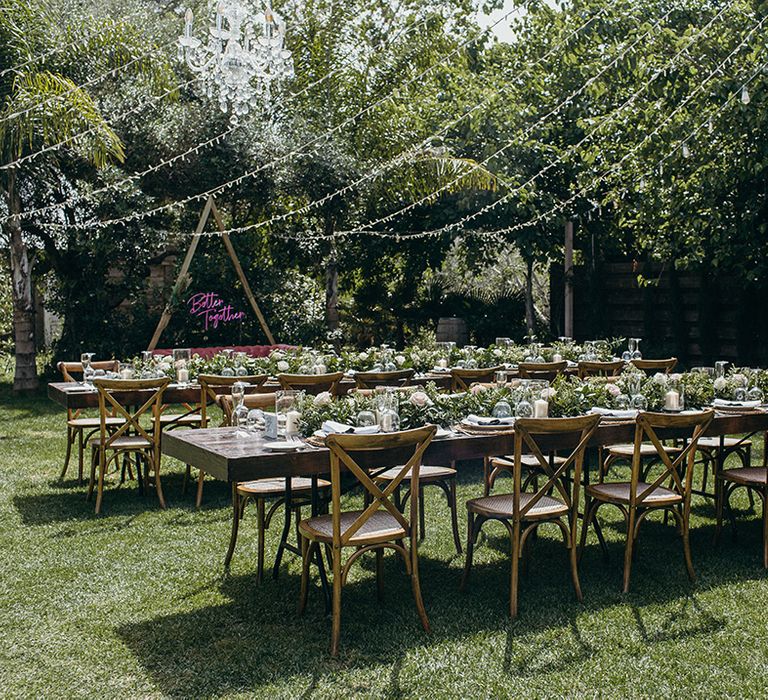 Outdoor wedding breakfast at Finca Monasterio with fiary lights and banquet table style dining 