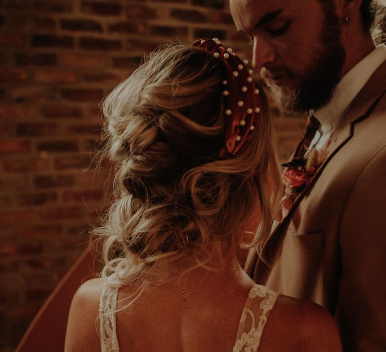 Bride in orange headband with pearls 