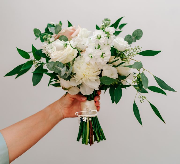 white bridal bouquet with foliage 