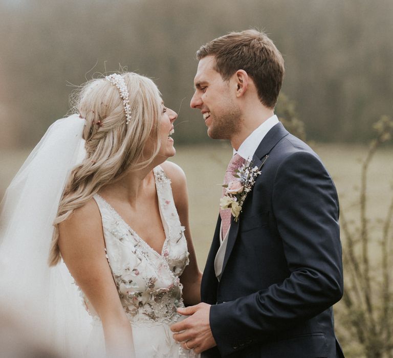 Bride and groom laughing 