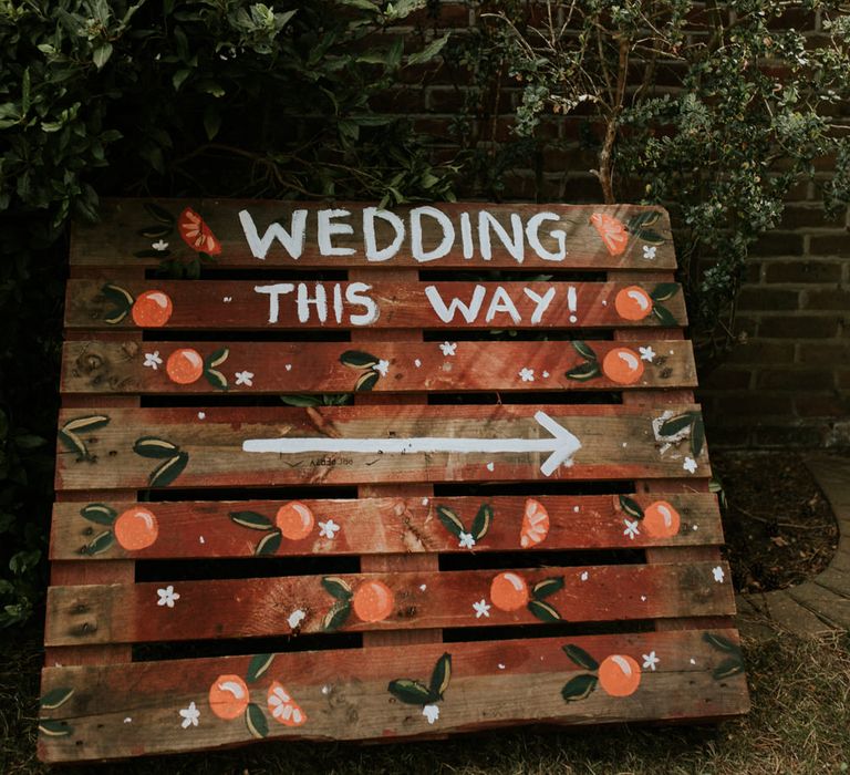 Wooden palette wedding direction sign 