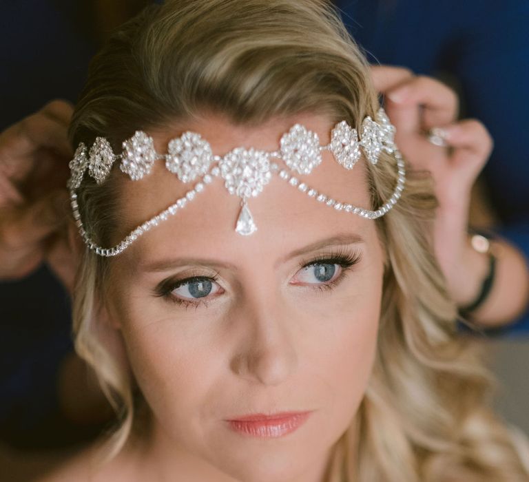 Bride having her headpiece fitted before her wedding at Hotel Marincanto