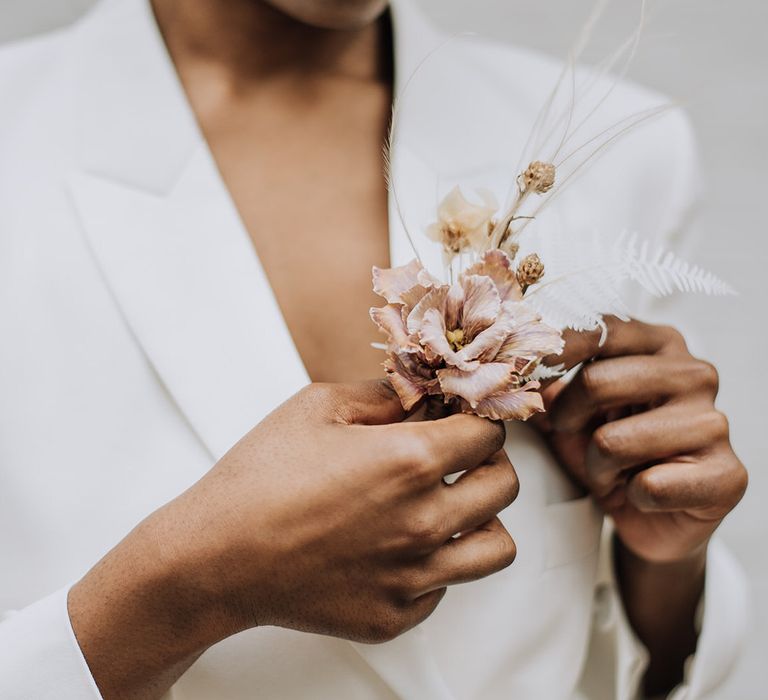 Neutral dried flowers for bridal blazer lapel