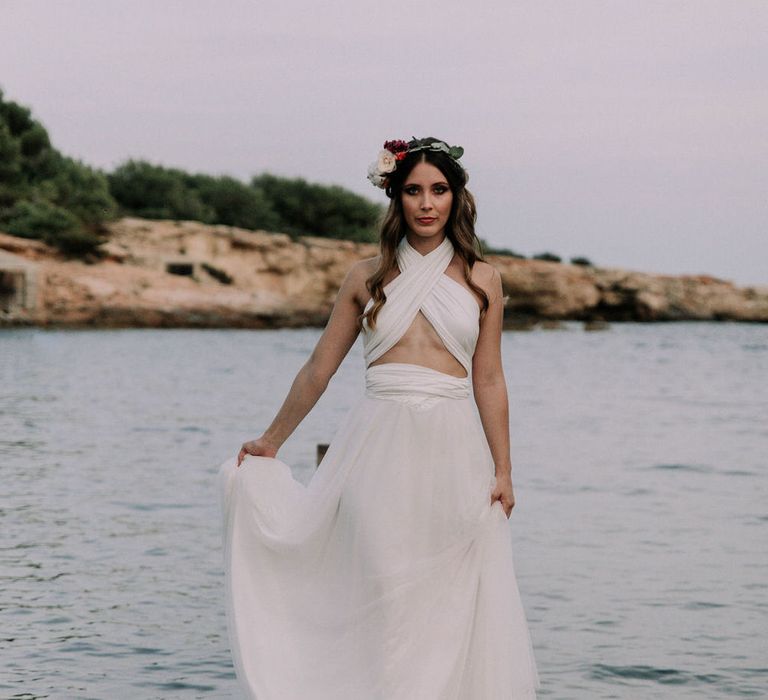 Goddess style bridal inspo by the sea with foliage head band and adjustable tulle wedding dress