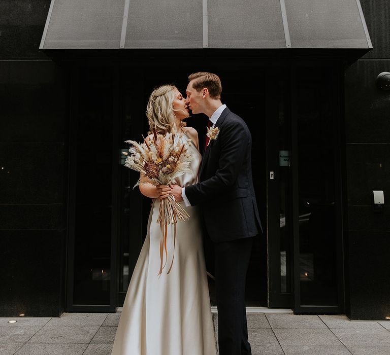 Bride and groom portrait outside Dakota Deluex in Leeds