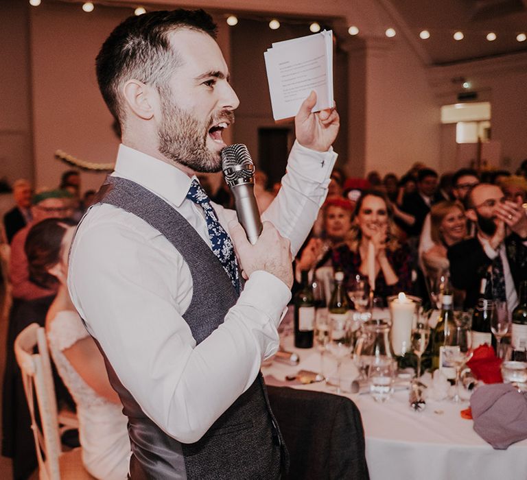 Groom gives wedding speech during reception