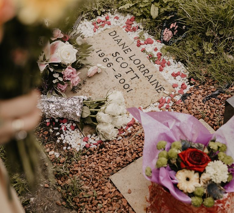 Grave of the groom's mother at the church where the wedding takes place 