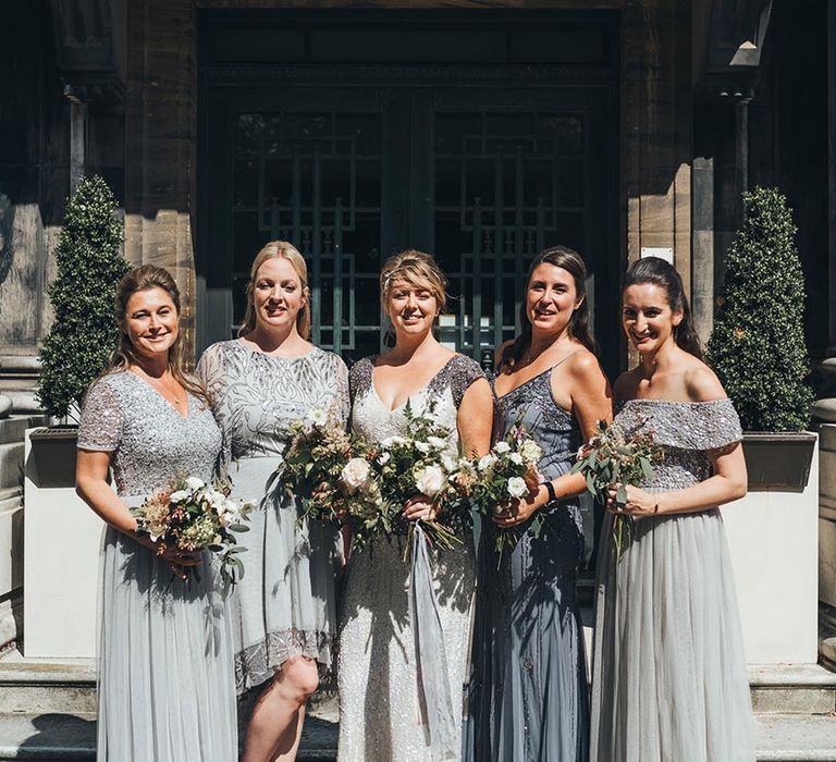 Bridesmaids in grey dresses with sequin detailing 