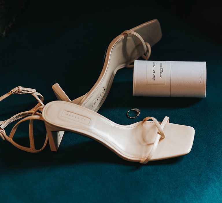 The bride's white square toe with low heels with the bride's Christian Dior wedding perfume 