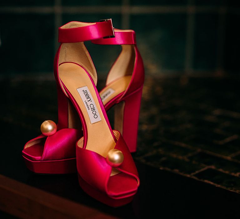 Bright pink Jimmy Choo wedding shoes with ankle strap and large pearl 