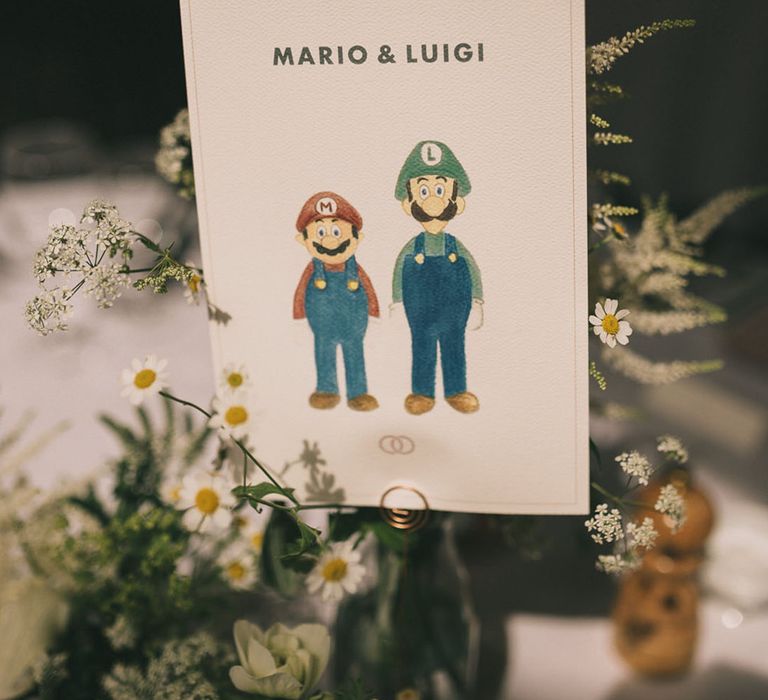 Iconic couples for wedding table name signs such as Mario and Luigi and Ross and Rachel 