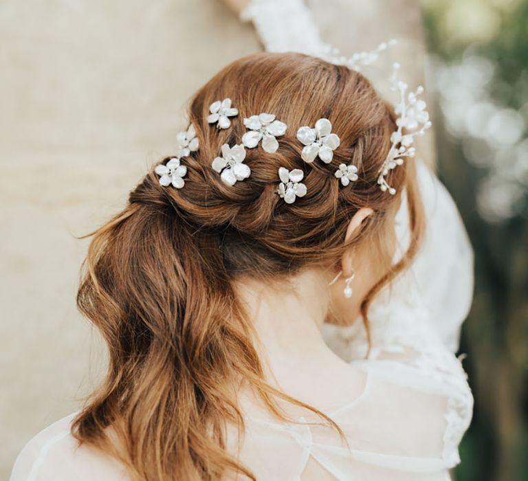 Stunning floral bridal hair accessories and clips in ponytail hairstyle 