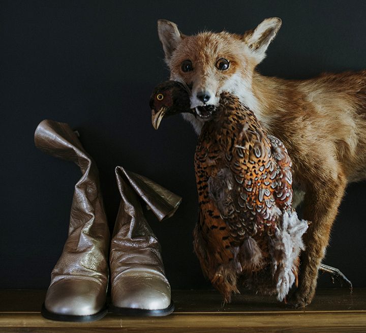 silver boot wedding shoes next to a stuffed fox