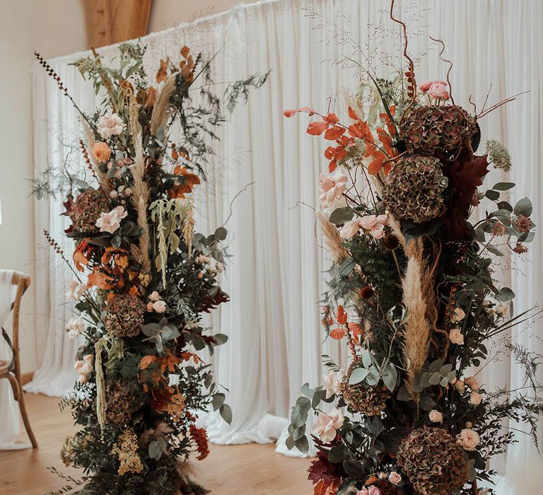 The Saddle Room wedding with autumnal flower columns for sage smudging ceremony 