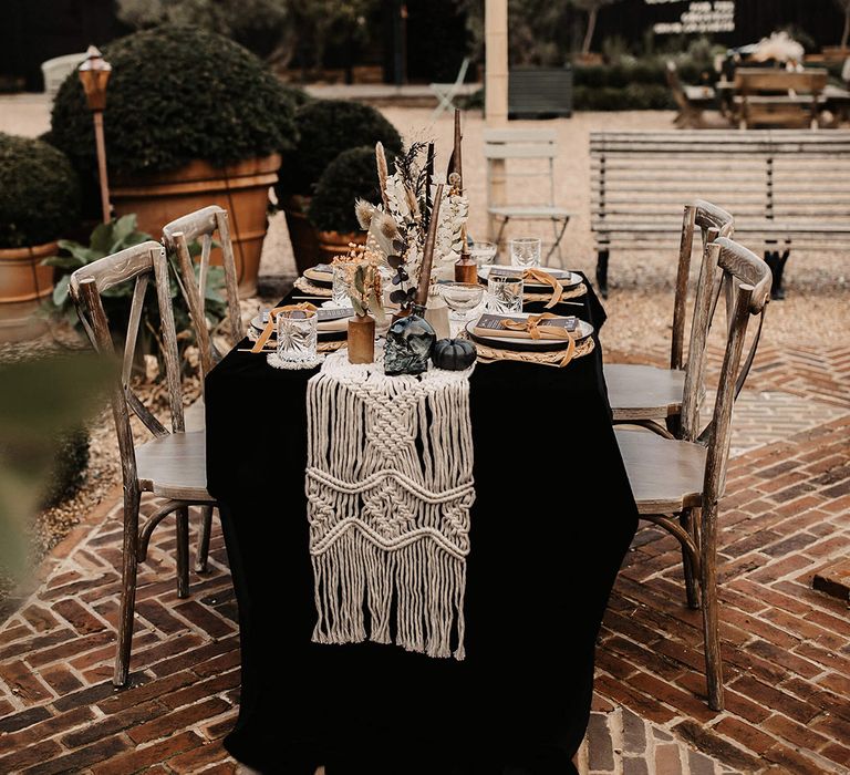 Gothic moody Halloween wedding table decor with macrame and more 