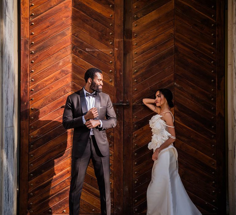 The bride and groom pose together for their couple portraits at South Africa wedding 