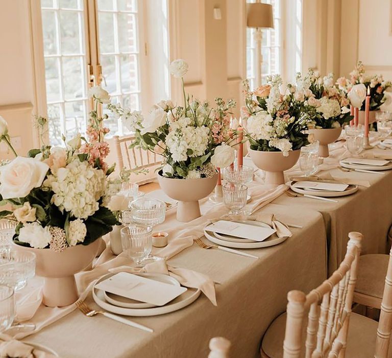 Neutral wedding tablescape with romantic elegant wedding decorations 