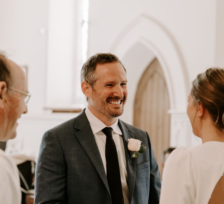 Groom during wedding ceremony in church