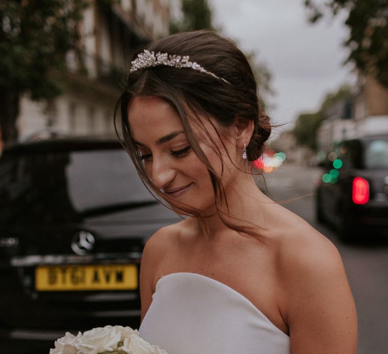 Stylish bride in Roland Mouret wedding dress with white bouquet 