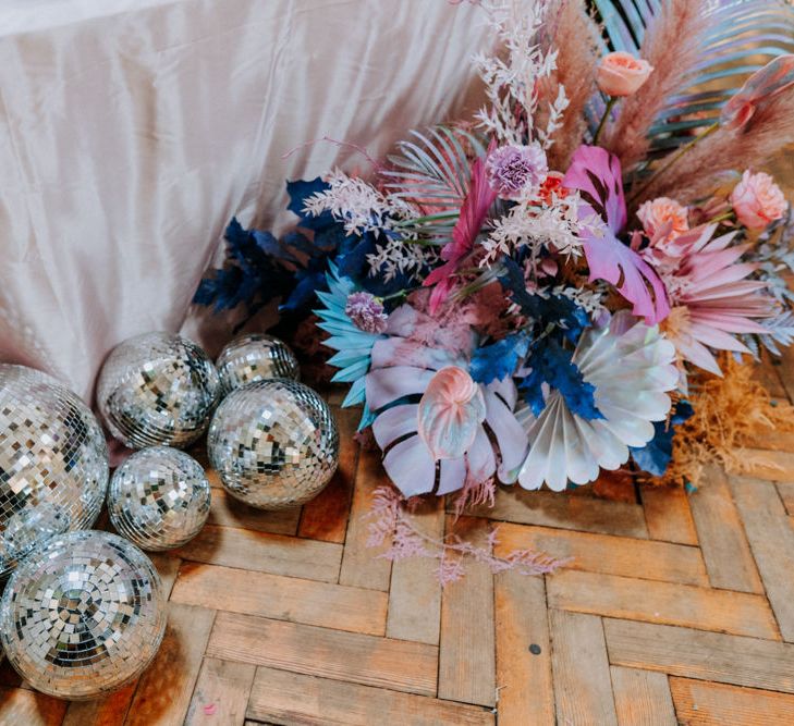 glitter balls and pastel flowers at festival wedding 