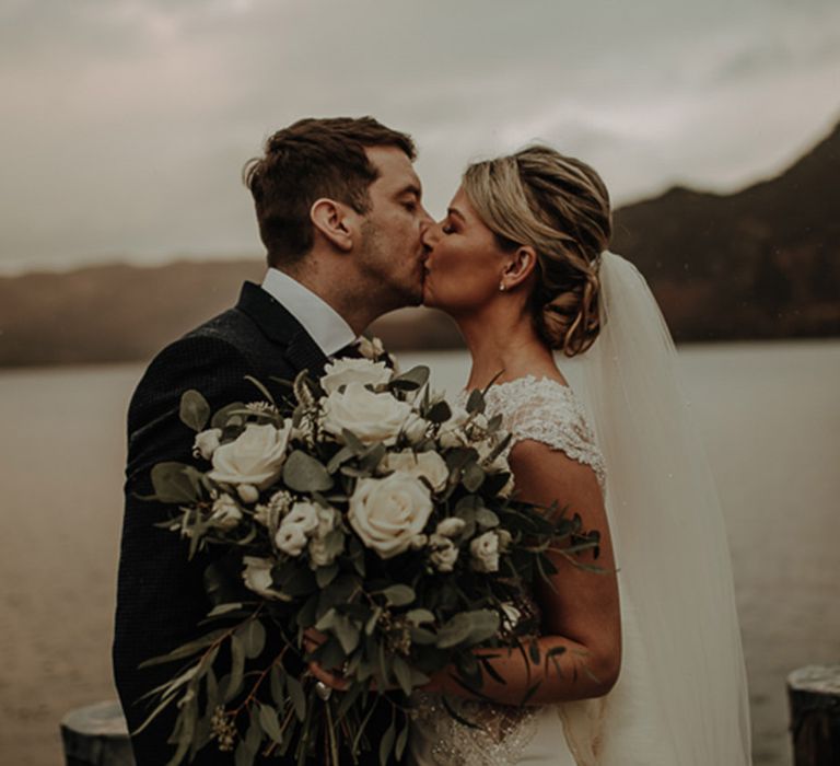 Bride and groom wedding photography overlooking scenic views in the Lake District 