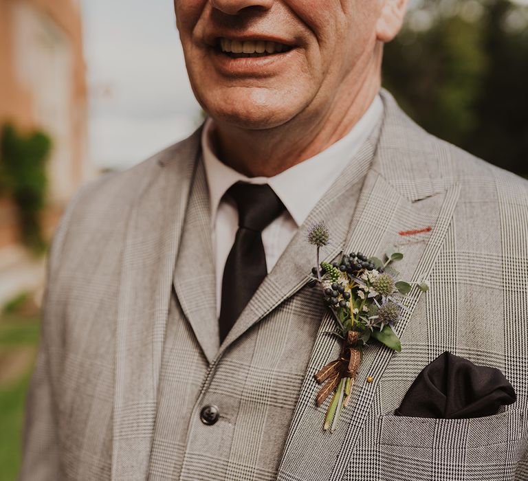 Father of the groom buttonhole and check suit 