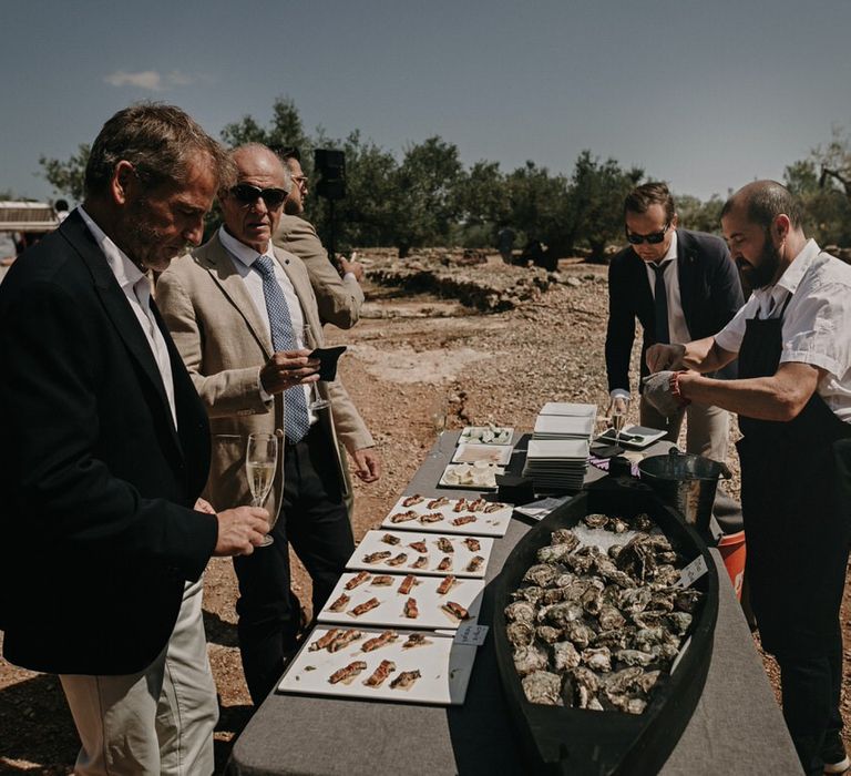 Fresh oysters at outdoor Spanish wedding buffet