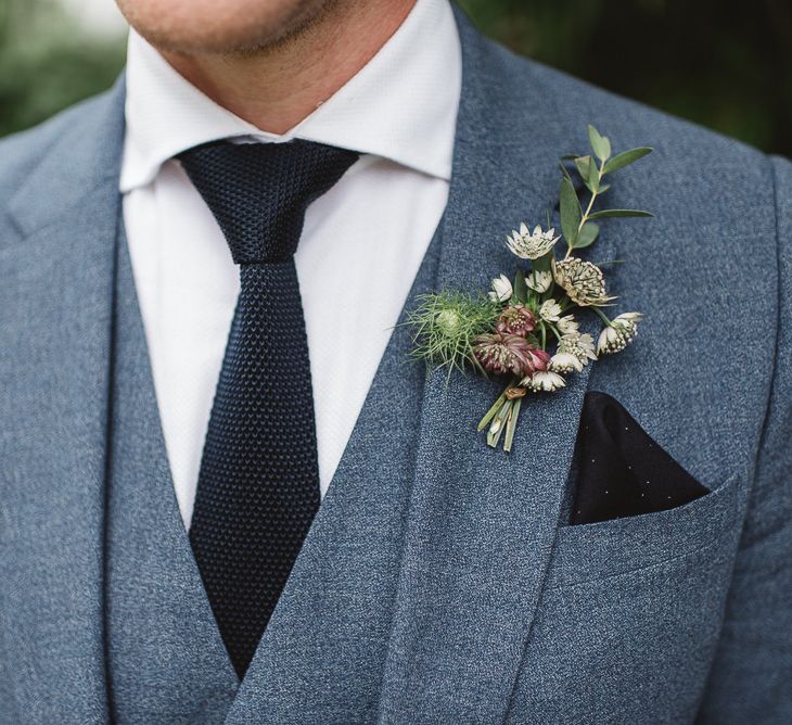 Groom in light blue three-piece suit with navy waffle tie and pocket square | Darek Smietana Photography