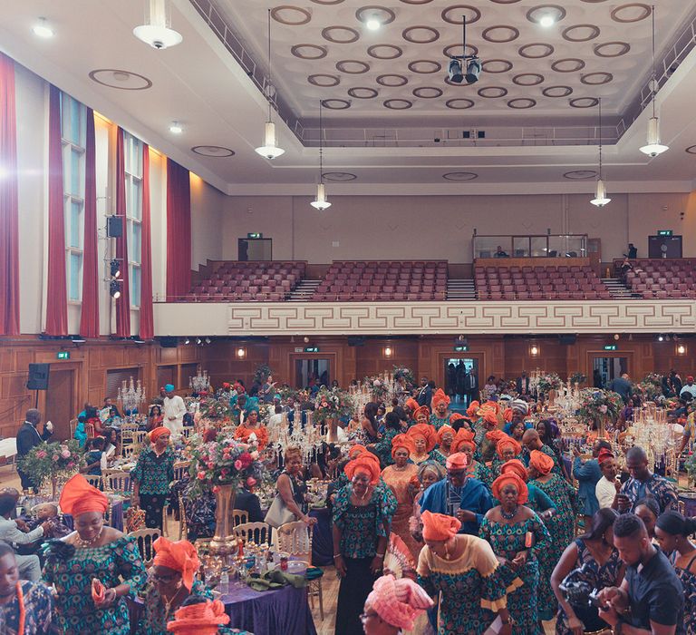 Wedding guests gather together during reception