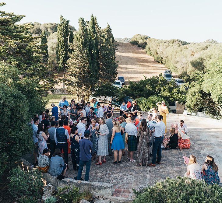 Wedding party gather outdoors in Menorca