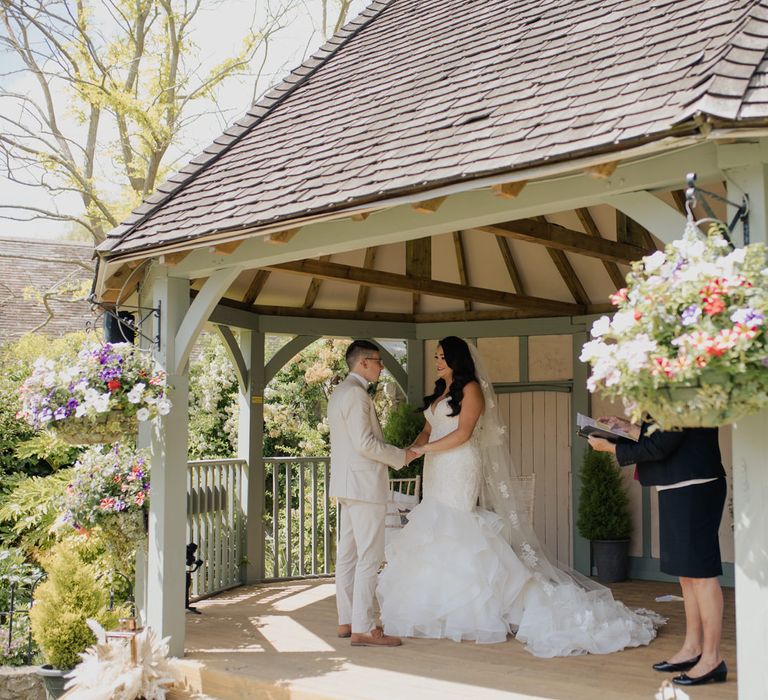 Civil wedding ceremony at Cooling Castle Barn with bride in a mermaid wedding dress and appliqué wedding dress