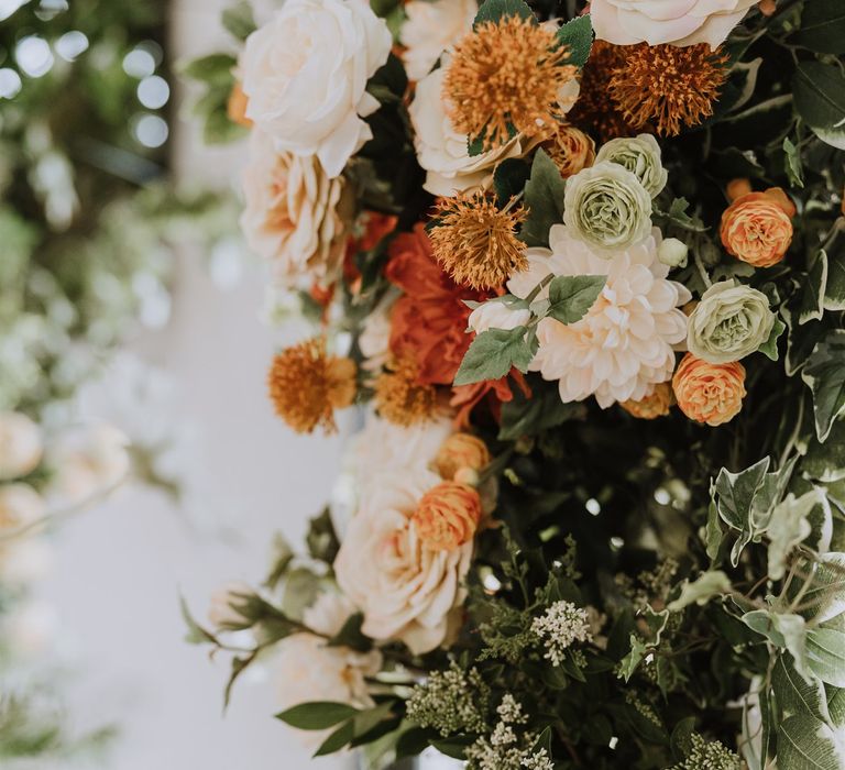 Blush pink and peach wedding flowers with foliage 