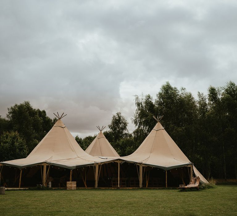 Three point tipi at Wellington Wood Norfolk for late summer wedding