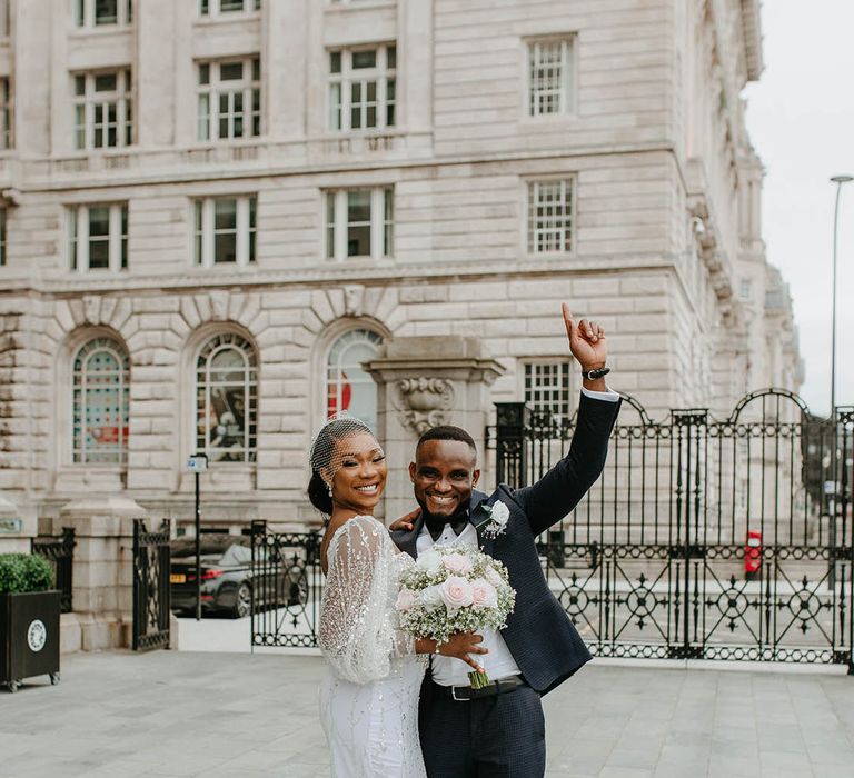 Bride & groom celebrate outdoors on their wedding day