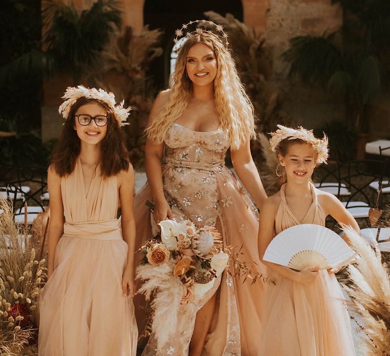 Bride wears celestial wedding gown complete with star crown on her wedding day