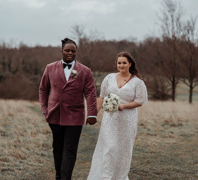 Bride & groom stand outside on their wedding day