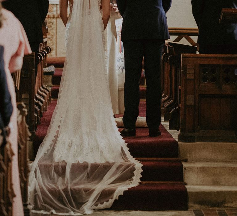 Bride and groom at their traditional church wedding with a Reverend officiant