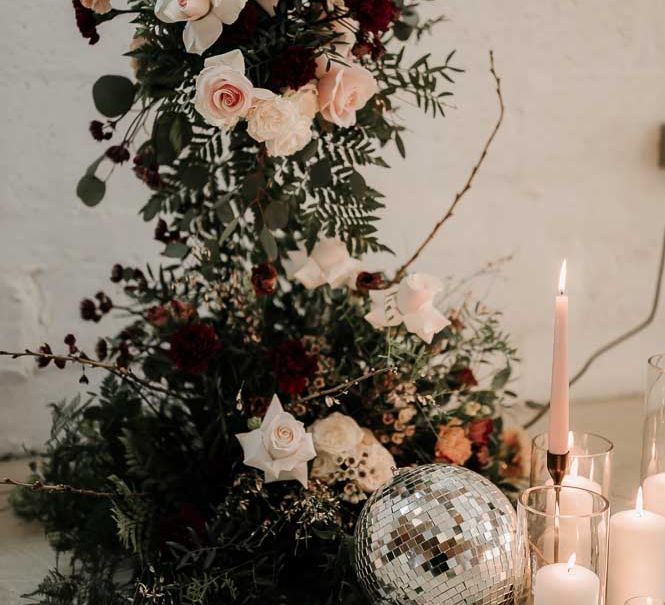 column wedding flowers, candles and silver disco balls altar wedding decor 