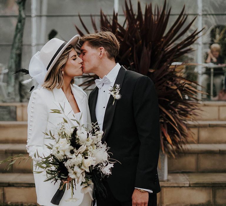 Bride and groom kiss each other on their wedding day 