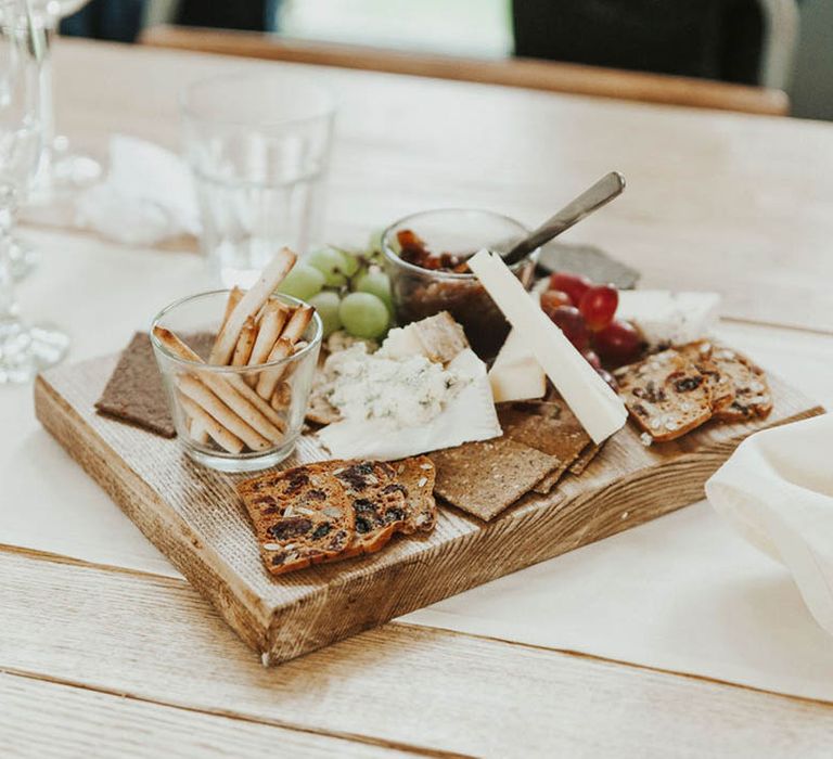 Charcuterie board laid along the wedding table 