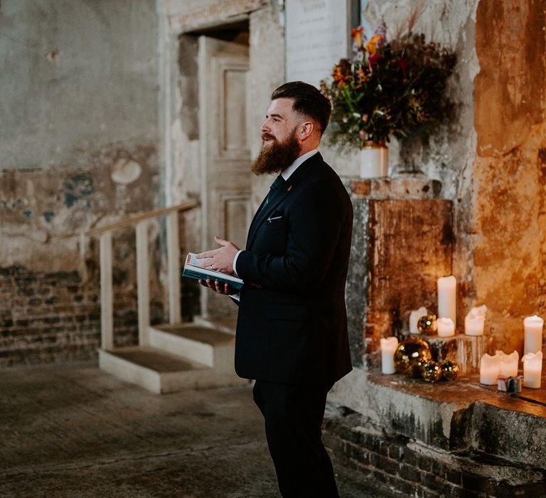 Wedding guest does reading at the front of Chapel  wedding venue in London