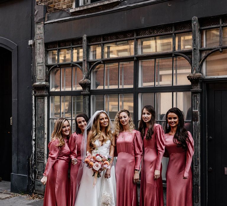 Dark pink high neck long sleeve bridesmaid dresses with the bride for London wedding 