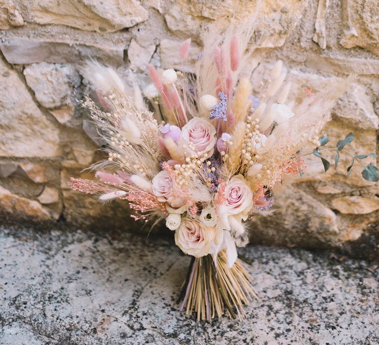 Pastel pink pampas grass wedding bouquet for boho destination wedding 