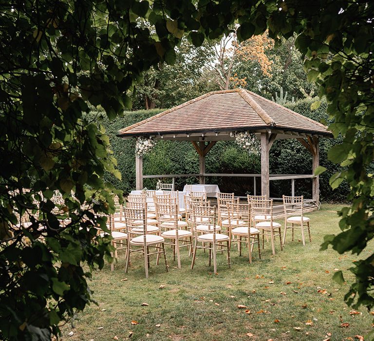 Outdoor wedding ceremony set up at Langshott Manor in Surrey 