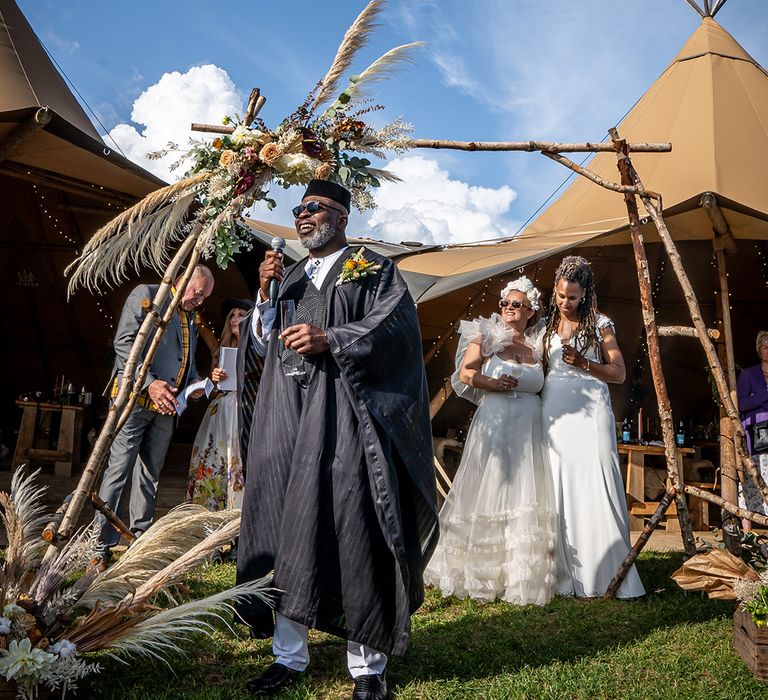 Father of the bride performs wedding speech for the guests 