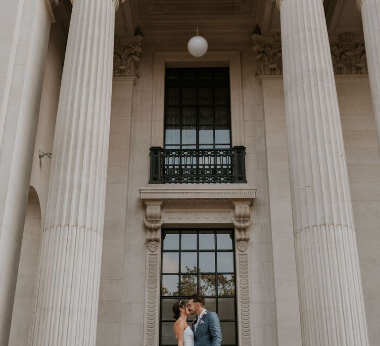 Bride and groom kissing at Old Marylebone Town Hall wedding